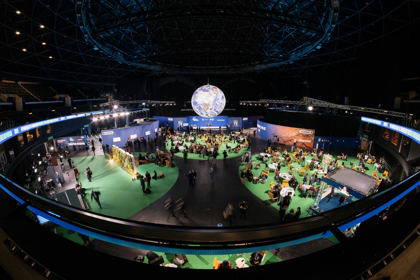SECC arena at COP26, globe over a room of people