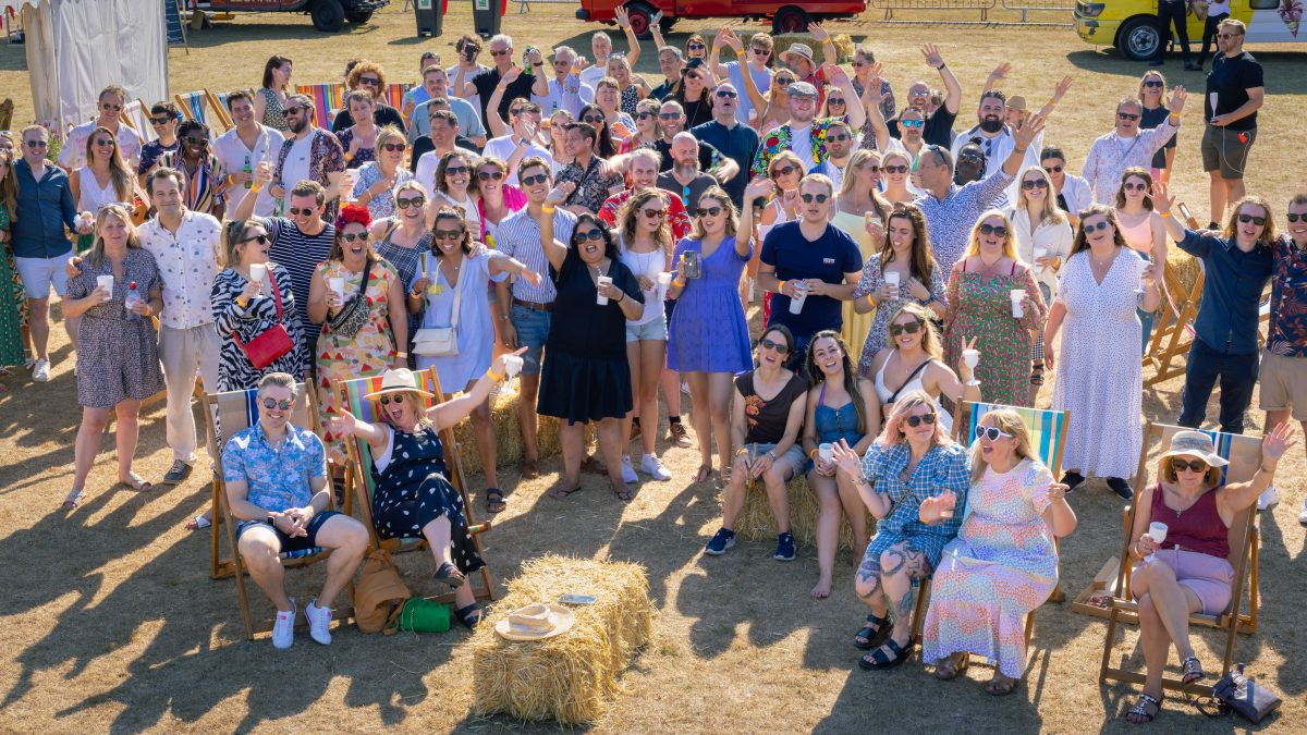 Group photo of the Identity team at a summer party