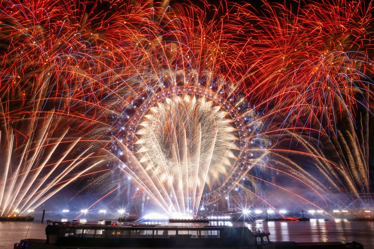 An impressive fireworks display lights up the London sky over the London Eye
