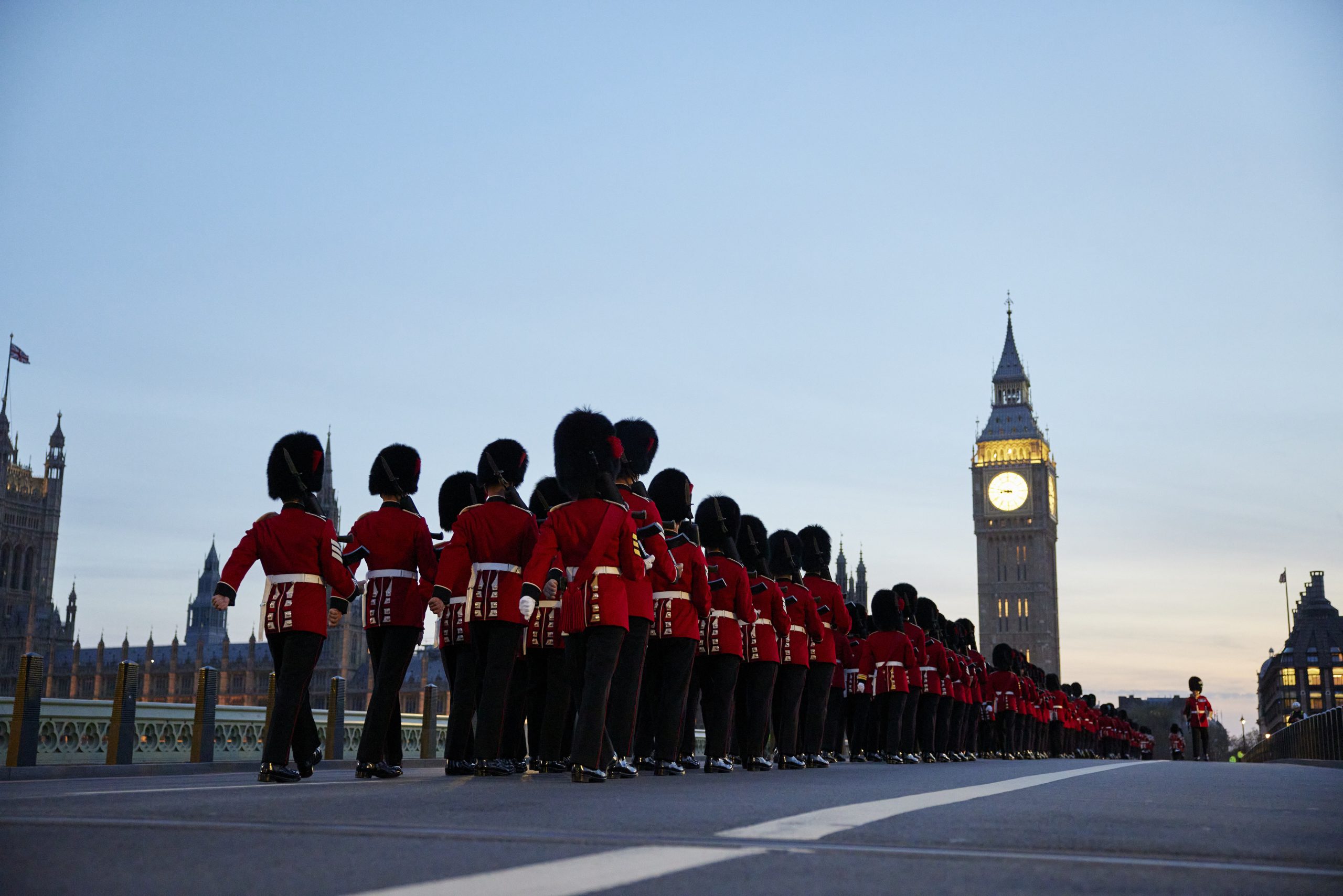 Royal guards march with Big Ben in the background