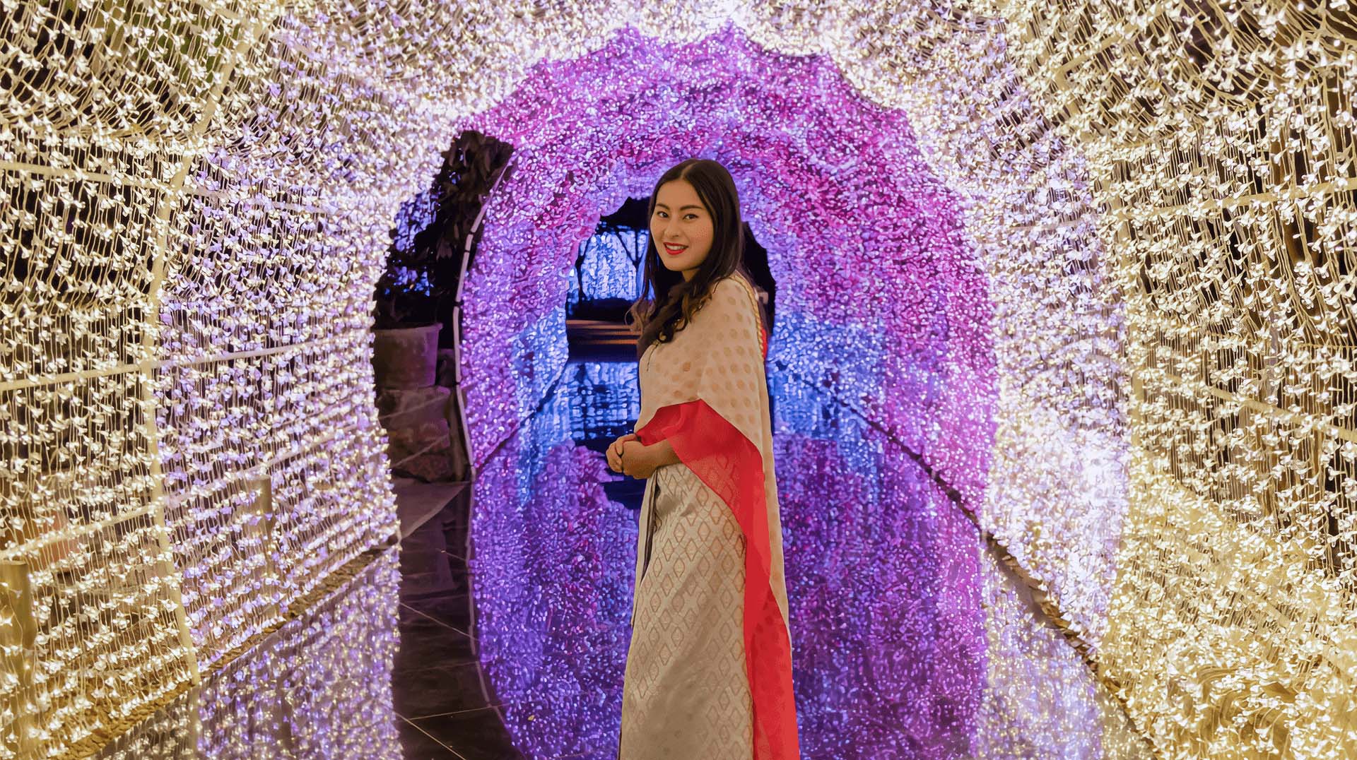 Lady standing in a light tunnel