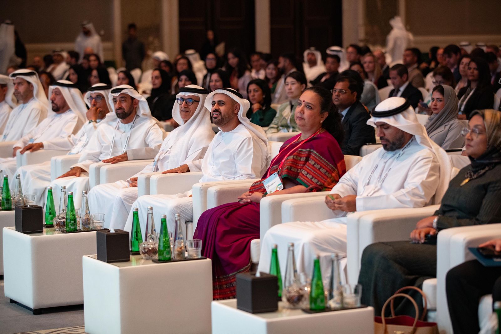 Audience facing a stage at a conference