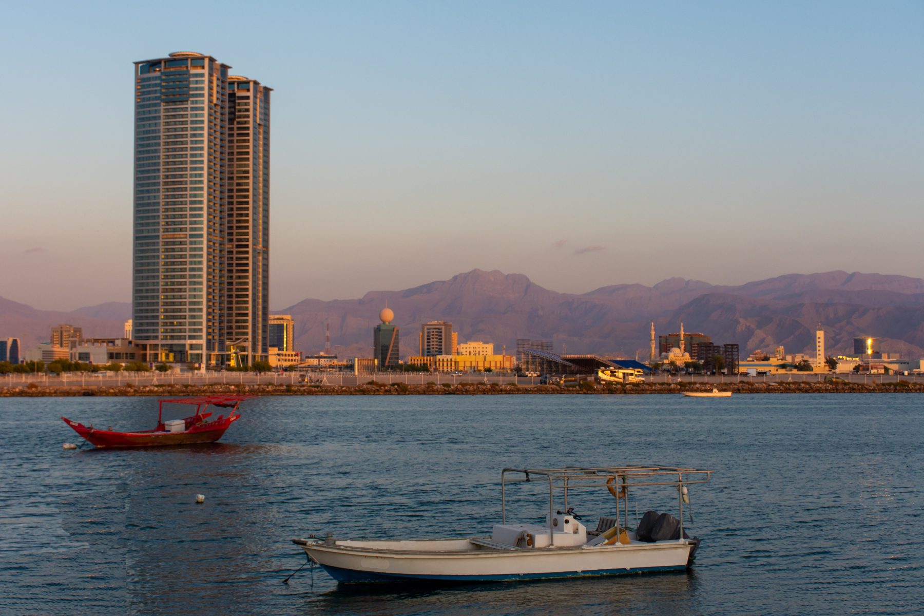 Panorama of a Ras al Khaimah View the mountains and city as the sun sets on the Hajar Mountains.