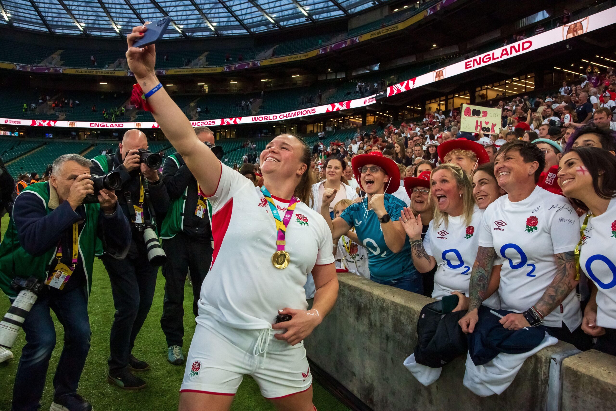 Sarah Bern posing with fans after winning Womens Rubgy World Cup