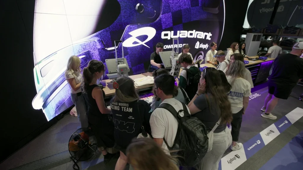 Crowd exploring the Quadrant x Shopify activation space