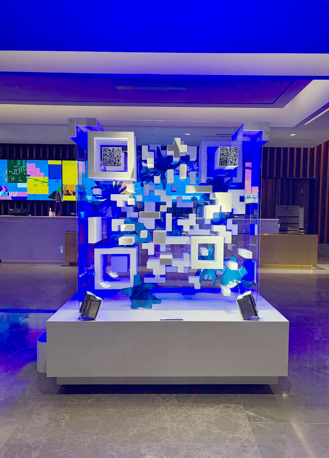 Webflow Conf interactive exhibition installation with illuminated blue displays and colourful digital graphics